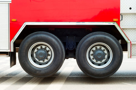 Fire truck partial feature, large area of red and wheels.