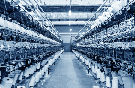 weaving machine produce white cloth.の写真素材