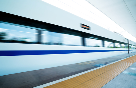 Dynamic high-speed train passing through the platformの写真素材