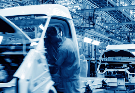 Car production line, skilled workers are working tense.の写真素材