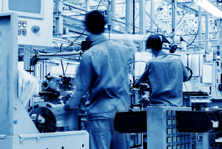 Car production line, skilled workers are working tense.の写真素材