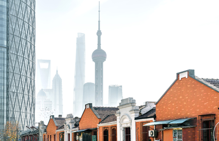 Traditional residential buildings and modern buildings, spanning a century, Shanghai, China.の写真素材