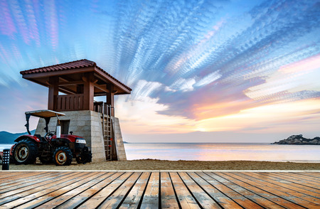 Beautiful sunset landscape at the beach, colorful sky and dramatic clouds over the wavy sea.の写真素材