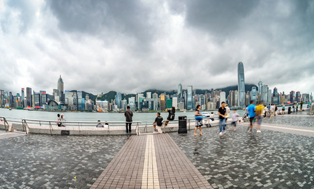 HONG KONG , CHINA - JULY. 25 : Travelers visiting the Tsim Sha Tsui Promenade (Avenue of the Stars) on July 25, 2013 in Hong Kong. The Avenue of Stars is located along the Victoria Harbor in Hong Kong.のeditorial素材