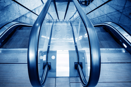 Blue escalator in airport hall, Shanghai, China.のeditorial素材