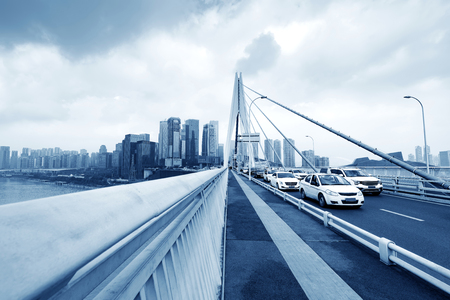 Modern bridge traffic and city skyscrapers, China Chongqing.の写真素材
