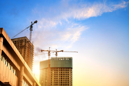 Building construction site, tall skyscrapers and cranes.の写真素材