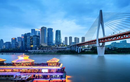 Chongqing architectural scenery and rivers and sky at nightの写真素材