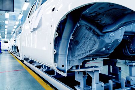 Car production line, skilled workers are working tense.の写真素材