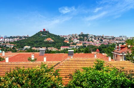 Bird's eye view of red roofs and cityscape , Qingdao , China .の写真素材