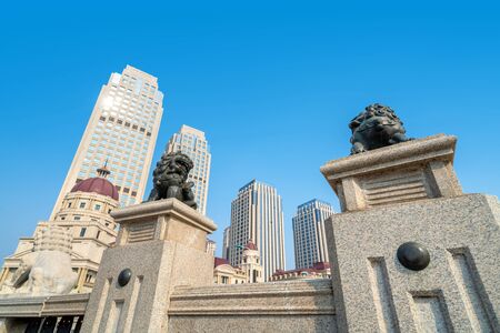 European old buildings and Chinese style stone lions , Tianjin , China .の写真素材