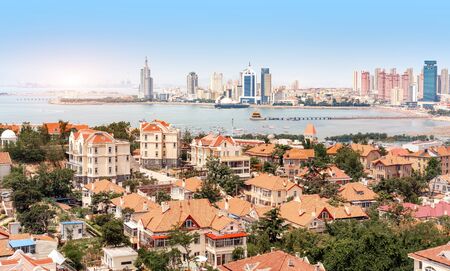 Bird's eye view of red roofs and cityscape, Qingdao, China.の写真素材