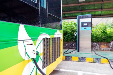 Charging station of an electric car in the background of a busの写真素材