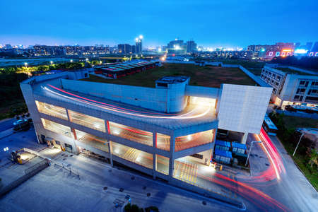 Night view of a three-dimensional parking lot, Beijing, China.のeditorial素材