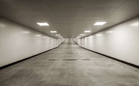 The dark pedestrian tunnel is empty and empty.の写真素材