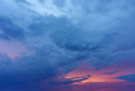 Sunset / sunrise with clouds, light rays and other atmospheric effectの写真素材