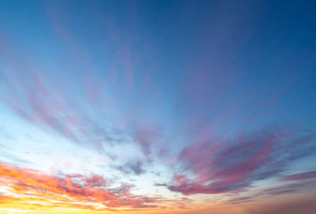 Sunset / sunrise with clouds, light rays and other atmospheric effectの写真素材
