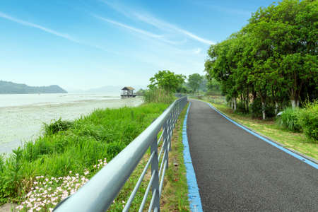 Pedestrian trail by the lakeの写真素材