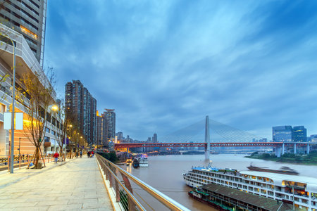 Chongqing architectural scenery and rivers and sky at nightの写真素材