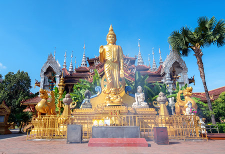 figure of Buddha and Buddhist palace in Xishuangbanna,Chinaの写真素材