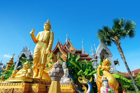 figure of Buddha and Buddhist palace in Xishuangbanna,Chinaの写真素材