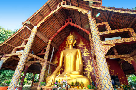 figure of Buddha and Buddhist palace in Xishuangbanna,Chinaの写真素材