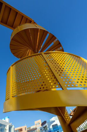 Outdoor spiral staircase on sky background.の写真素材