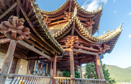 Ancient buildings on the shore of YilÃ³ng Lake in Shiping County, Yunnan, China.の写真素材
