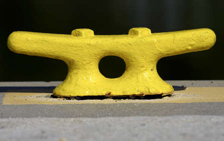 Yellow mooring postの写真素材