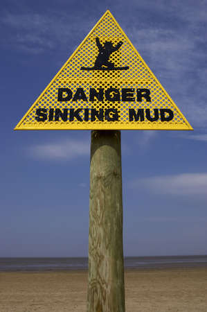 Danger sinking mud sign, sand point beach England ukの写真素材