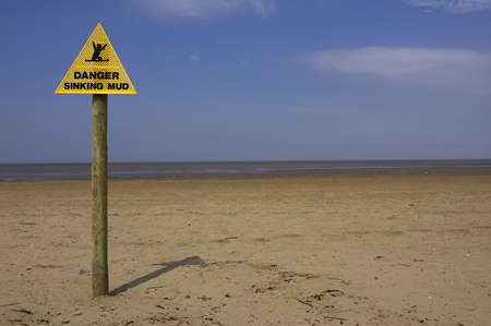 Danger sinking mud sign, sand point beach England ukの写真素材