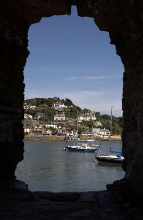 view through the window of bayards cove fort towards the mouth of the river dart, start bay with the castle on the right dartmouth devon england europe uk taken in july 2006の写真素材