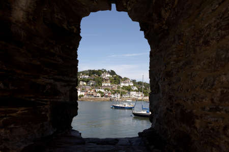 view through the window of bayards cove fort towards the mouth of the river dart, start bay with the castle on the right dartmouth devon england europe uk taken in july 2006の写真素材