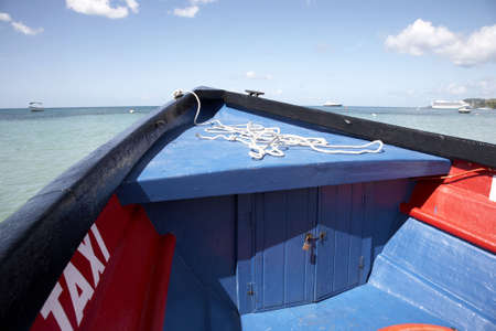 the wooden bow of a water taxi at grand anse beach st. george's Grenada windward islands caribbean lesser antillies west indiesの写真素材