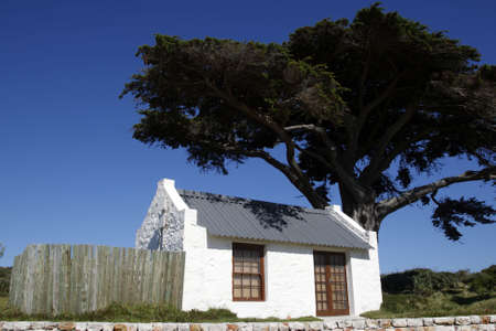 small white house near buffelsfontein visitors centre within the table mountain national park near the cape of good hope cape town western cape province south africa の写真素材