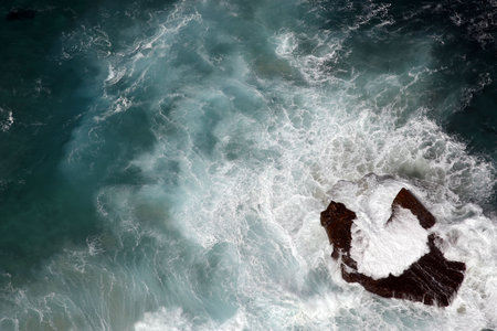looking down onto a single rock along the coastline of cape point table mountain national park cape...