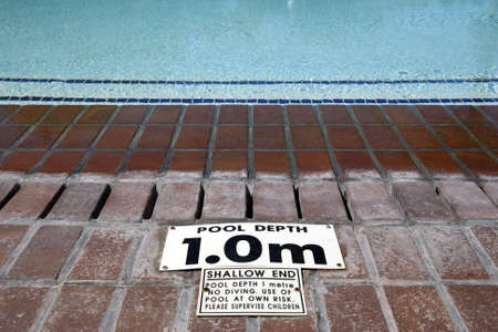 pool depth sign at the edge of the swimming pool knysna western cape province south africaの写真素材