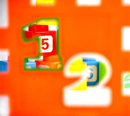 Cubes with numbers seen through number-shaped holesの写真素材
