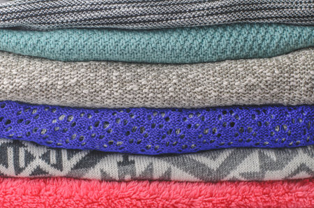 Stack of cozy colorful sweaters