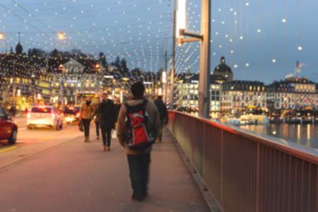 Abstract blurred of people walking on the bridge in evening before christmas in Lucerne, Switzerlandの写真素材