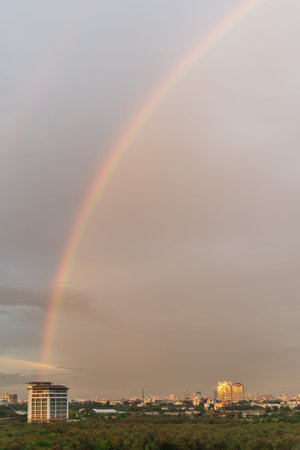 Rainbow over bangkok city in the evening