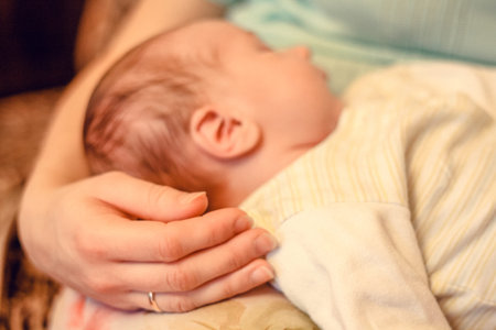 Close up baby head concept photo. Newborn. Beauty of maternity. Side view photography with child...