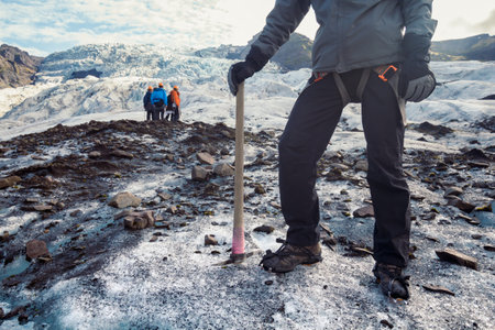 Professional alpinist on snowy mountain scenic photography. Picture of people with tourists at...