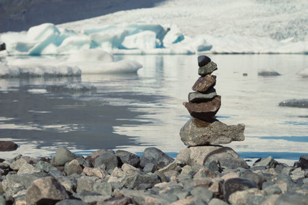 Close up rocks stack on sea coast concept photo. Polar nature. Front view photography with large...