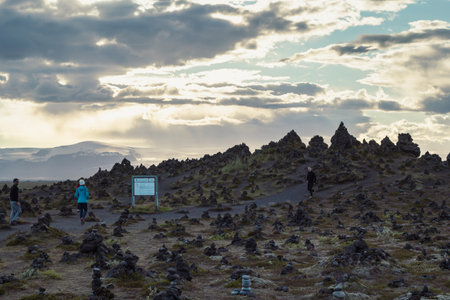 People looking at rock pyramid landscape photo. Beautiful nature scenery photography with cloudy sky on background. Idyllic scene. High quality picture for wallpaper, travel blog, magazine, articleの写真素材