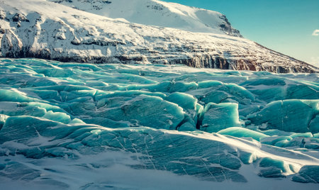 Ice wave of ancient glacier landscape photo. Beautiful nature scenery photography with mountain on background. Idyllic scene. High quality picture for wallpaper, travel blog, magazine, articleの写真素材