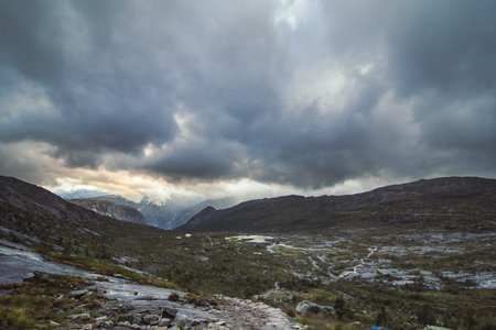 Wild valley with river at highland landscape photo. Beautiful nature scenery photography with sky on...