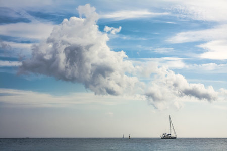 Yacht sailing tranquil sea landscape photo. Beautiful nature scenery photography with clouds in sky...