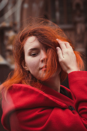 Close up smiling lady with red hair on street portrait picture. Closeup front view photography with...