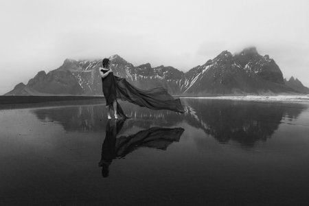 Attractive woman in gentle dress on beach monochrome scenic photography. Picture of person with...